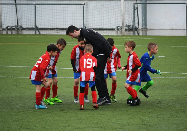 What are the best techniques for improving heading skills in young football players?